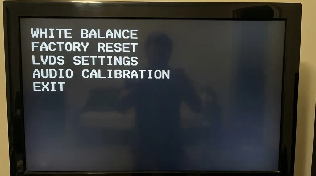 Haier TV service menu on screen showing calibration and factory settings options
